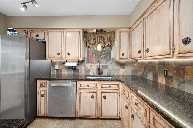 11809 Lori Dr, Corpus Christi, TX 78410 - kitchen featuring stainless steel appliances, a sink, light brown cabinets, and decorative backsplash