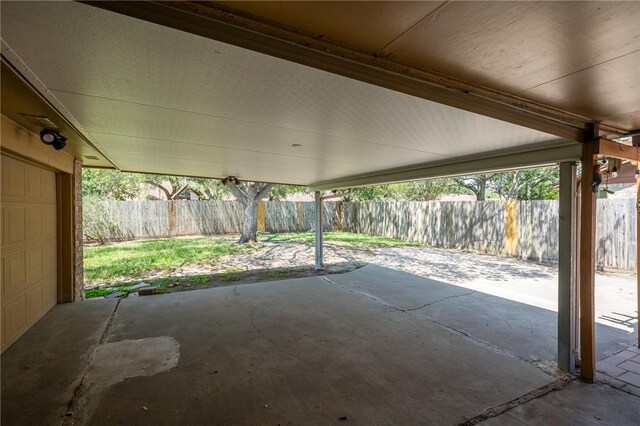 11809 Lori Dr, Corpus Christi, TX 78410 - view of patio / terrace with a fenced backyard and a garage