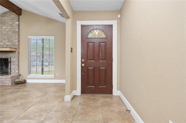 11809 Lori Dr, Corpus Christi, TX 78410 - entryway featuring a fireplace, baseboards, and beamed ceiling