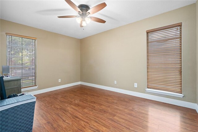 11809 Lori Dr, Corpus Christi, TX 78410 - spare room with wood finished floors, baseboards, and a ceiling fan