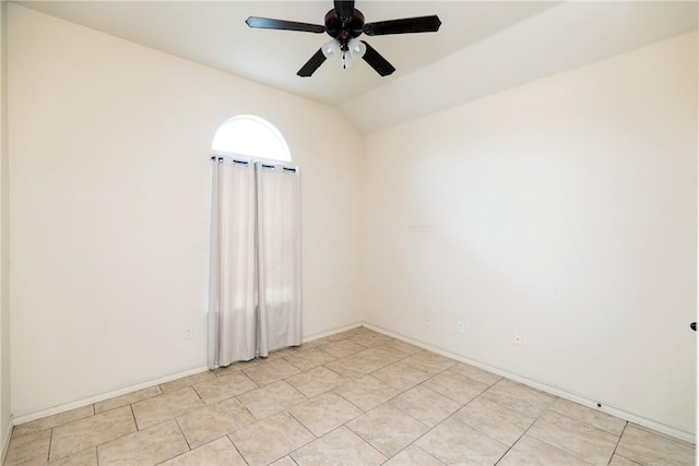 unfurnished room with lofted ceiling, ceiling fan, baseboards, and light tile patterned flooring