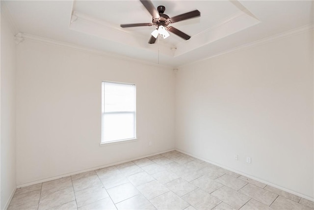 unfurnished room featuring ceiling fan, ornamental molding, and a raised ceiling