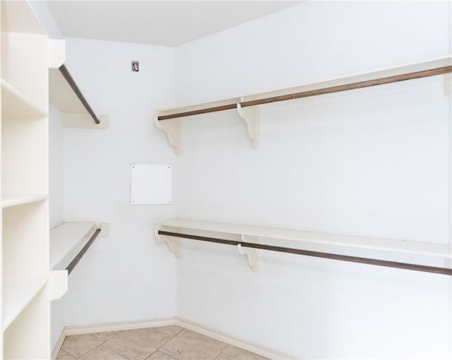 walk in closet featuring light tile patterned floors