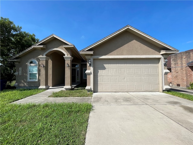 ranch-style home featuring a front lawn and a garage