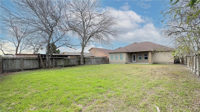 view of yard with a fenced backyard