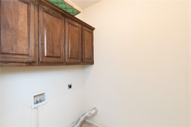 laundry area with cabinet space, hookup for a washing machine, and electric dryer hookup