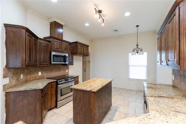 kitchen with stainless steel appliances, visible vents, decorative backsplash, and light stone countertops