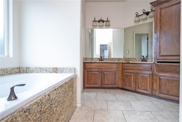 full bath featuring tile patterned flooring, double vanity, a sink, and a bath