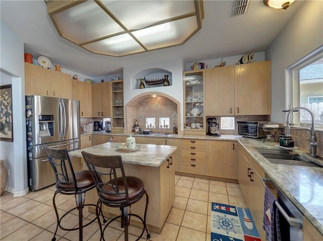 13810 Eaglesnest Bay Dr, Corpus Christi, TX 78418 - kitchen with stainless steel fridge with ice dispenser, a sink, light brown cabinets, and tasteful backsplash