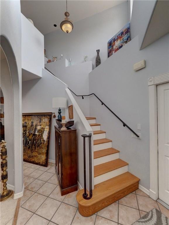 13810 Eaglesnest Bay Dr, Corpus Christi, TX 78418 - staircase featuring tile patterned flooring and arched walkways