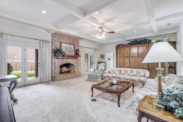 4217 Spring Creek Dr, Corpus Christi, TX 78410 - carpeted living room with ceiling fan, visible vents, a fireplace, beam ceiling, and coffered ceiling