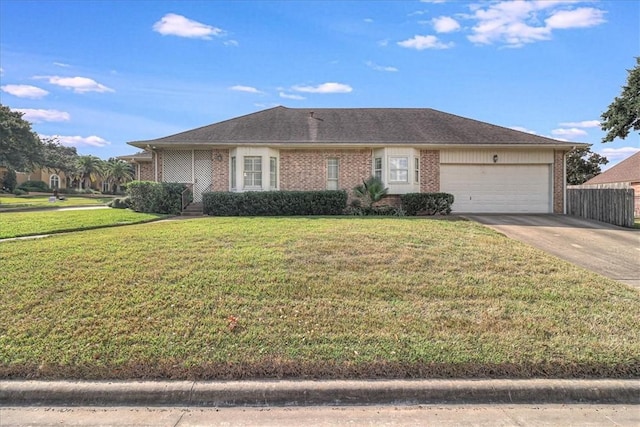 4217 Spring Creek Dr, Corpus Christi, TX 78410 - ranch-style home featuring driveway, a garage, brick siding, fence, and a front lawn