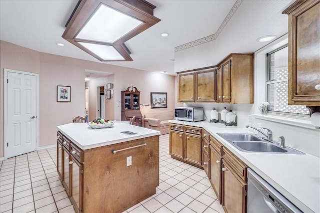 4217 Spring Creek Dr, Corpus Christi, TX 78410 - kitchen with a center island, a sink, light tile patterned floors, and stainless steel appliances