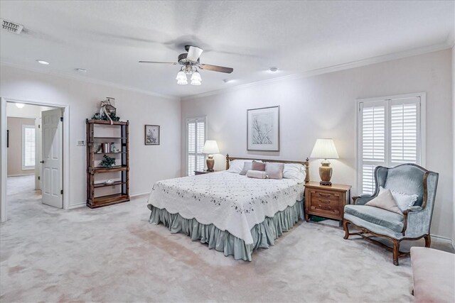 4217 Spring Creek Dr, Corpus Christi, TX 78410 - bedroom featuring visible vents, ornamental molding, light carpet, baseboards, and a ceiling fan