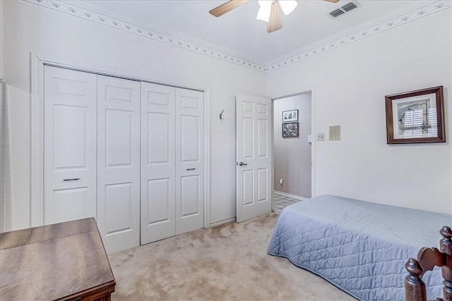 4217 Spring Creek Dr, Corpus Christi, TX 78410 - bedroom featuring a ceiling fan, visible vents, light carpet, and a closet