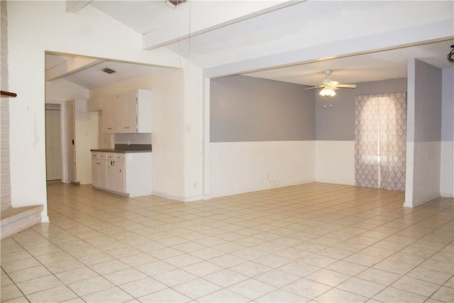 33 Encino Loma, Beeville, TX 78102 - spare room with vaulted ceiling, a ceiling fan, and light tile patterned floors