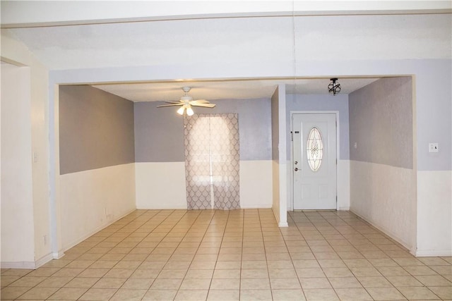 33 Encino Loma, Beeville, TX 78102 - foyer with a wainscoted wall, a ceiling fan, and light tile patterned floors