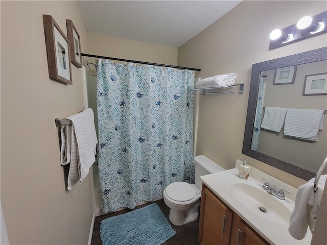 full bathroom featuring curtained shower, toilet, and vanity