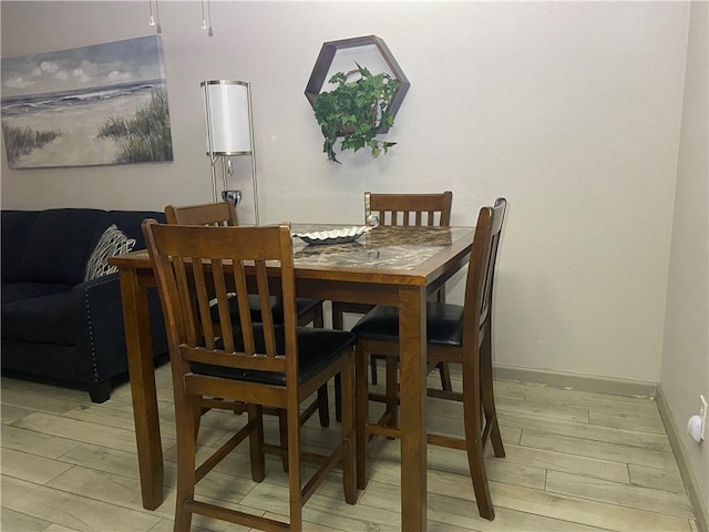 dining room featuring light hardwood / wood-style flooring