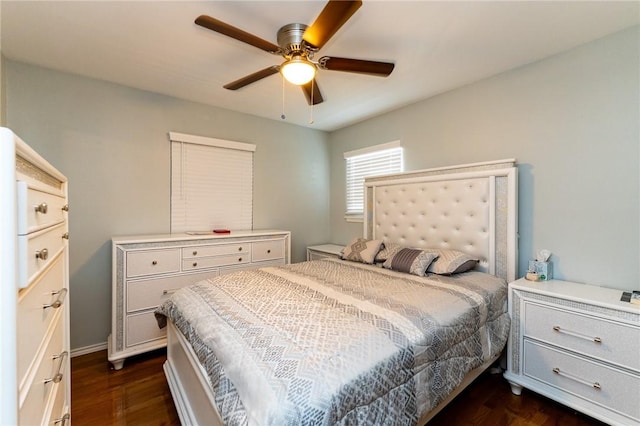 bedroom featuring ceiling fan and dark hardwood / wood-style floors