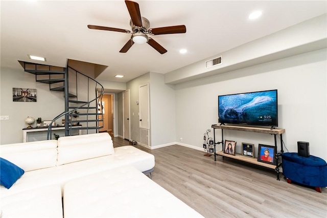 living room with ceiling fan and wood-type flooring