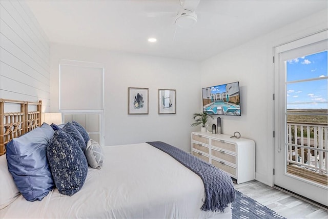4885 S State Highway 361st St Unit H, Port Aransas, TX 78373 - bedroom with light wood finished floors, a ceiling fan, and recessed lighting