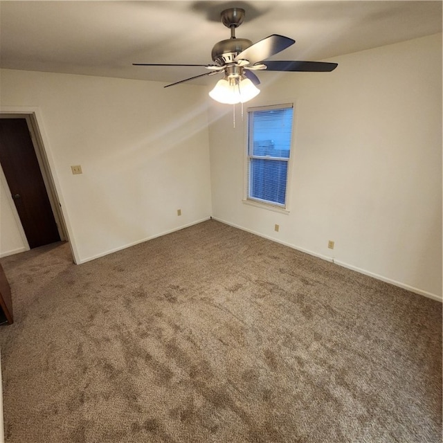 empty room with carpet and ceiling fan