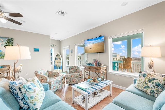 tiled living room featuring ceiling fan and ornamental molding