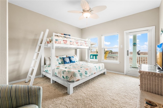 bedroom with carpet flooring, access to outside, and ceiling fan