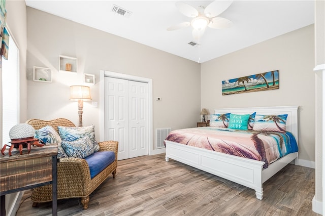 bedroom featuring a closet, hardwood / wood-style floors, and ceiling fan