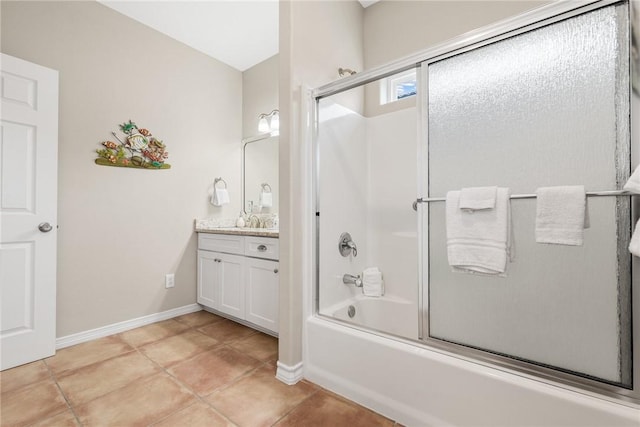 664 Kara Prt, Aransas, TX 78373 - bathroom with vanity, tile patterned floors, bath / shower combo with glass door, and baseboards