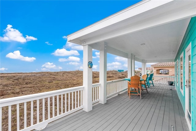 664 Kara Prt, Aransas, TX 78373 - wooden deck with covered porch