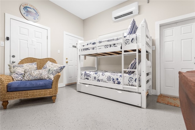 bedroom featuring a wall unit AC