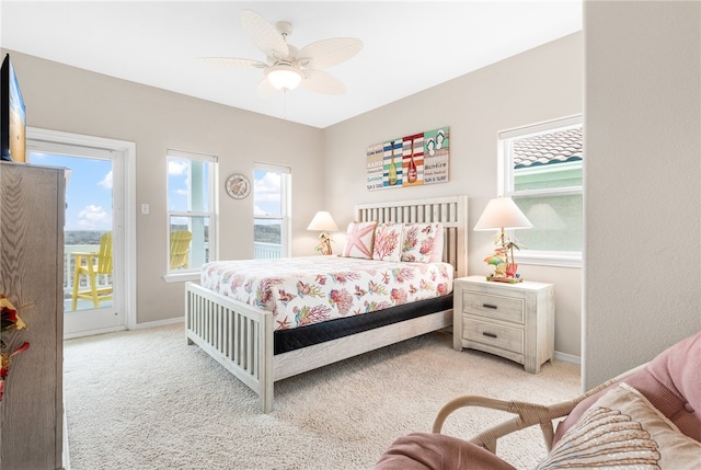 carpeted bedroom featuring ceiling fan and access to outside