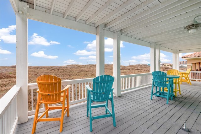 wooden deck featuring ceiling fan