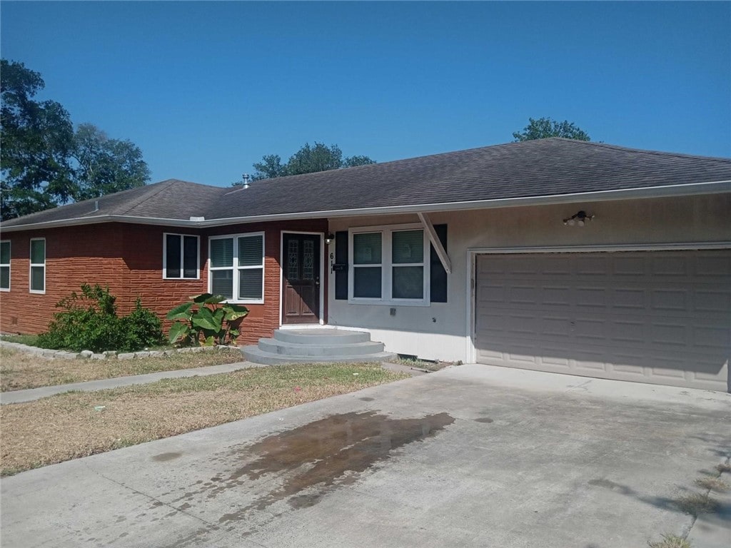 ranch-style home with a garage