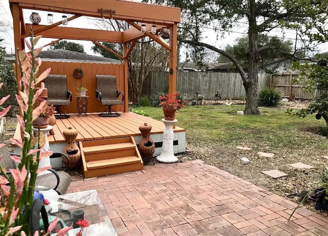 4114 Lowman St, Corpus Christi, TX 78411 - fenced backyard with a wooden deck and a patio area