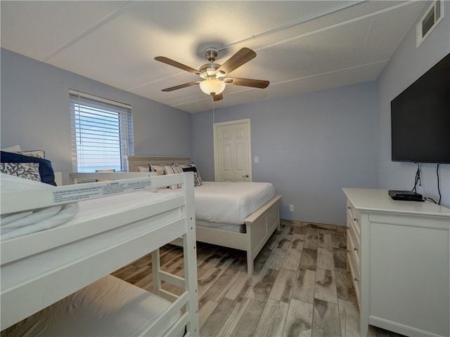 bedroom featuring ceiling fan and light hardwood / wood-style flooring