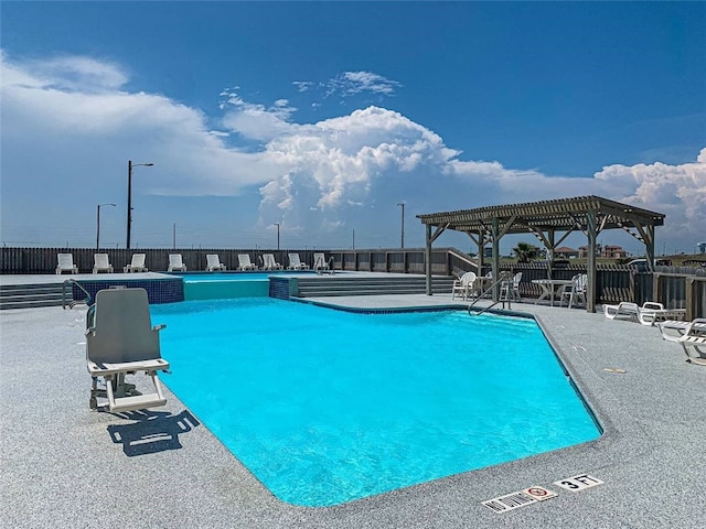 6109 State Highway 361 Unit 1101, Port Aransas, TX 78373 - community pool with a pergola, fence, and a patio