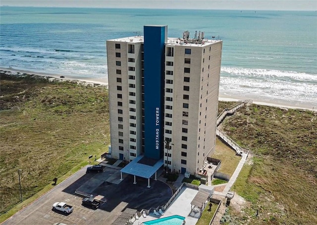 aerial view featuring a view of the beach and a water view