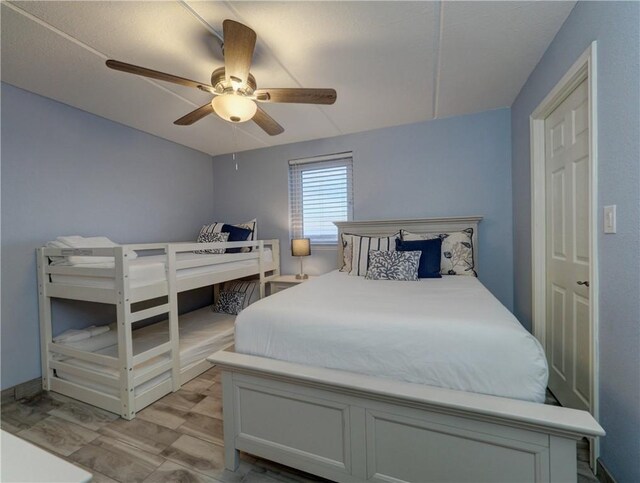 6109 State Highway 361 Unit 1101, Port Aransas, TX 78373 - bedroom with a ceiling fan and light wood-style floors