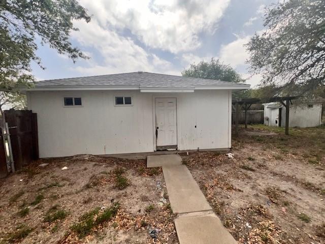 667 Lisa Ann Dr, Aransas Pass, TX 78336 - view of outbuilding featuring an outdoor structure and fence