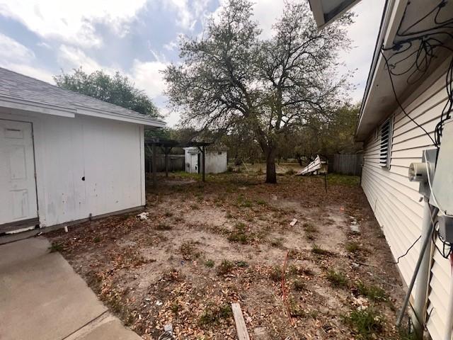 667 Lisa Ann Dr, Aransas Pass, TX 78336 - view of yard featuring an outbuilding and a shed
