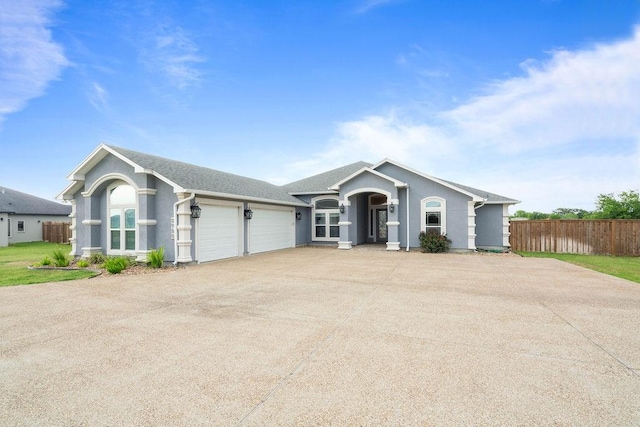 3726 Amanda Ln, Robstown, TX 78380 - single story home with fence, an attached garage, stucco siding, and concrete driveway