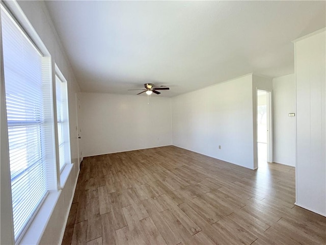 empty room featuring light wood-style floors and ceiling fan