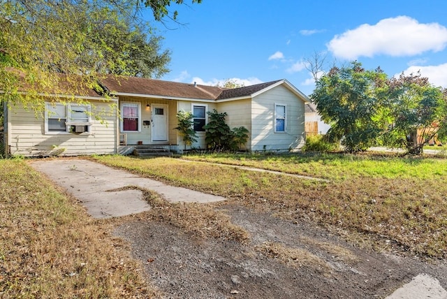 ranch-style home with a front lawn