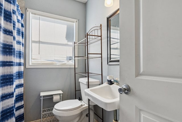 bathroom with a sink and toilet