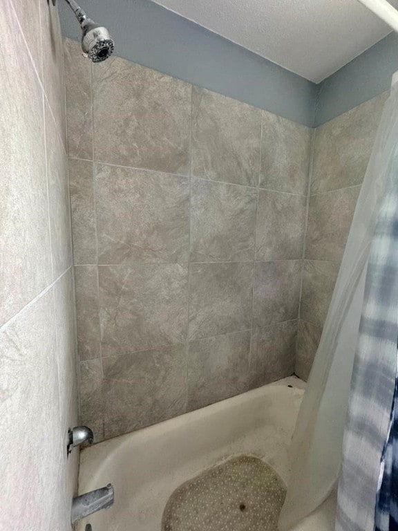 full bathroom with shower / tub combo with curtain