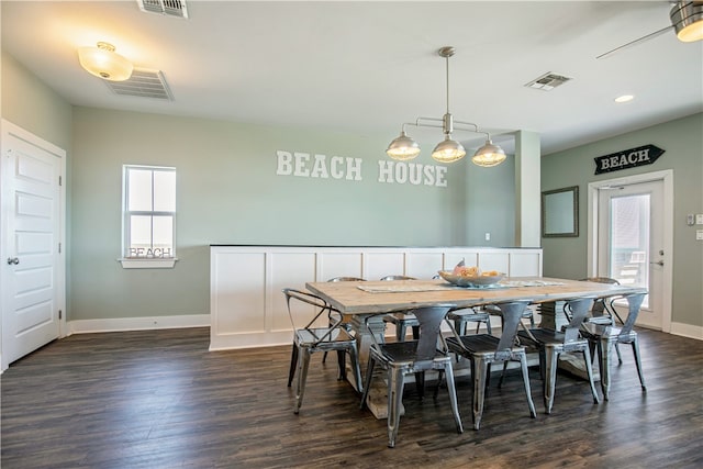 dining area featuring dark wood-type flooring