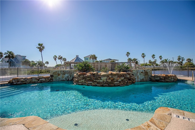 view of pool featuring pool water feature